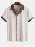 Camisa arrugada con bordado de palmeras en contraste